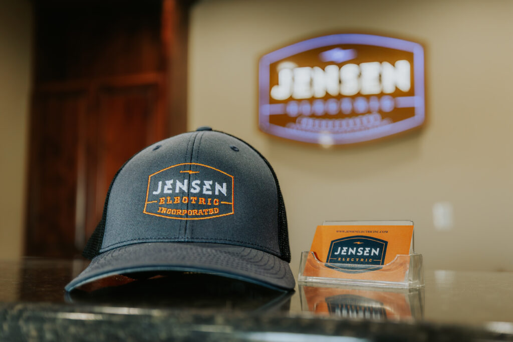 Jensen Electric Business Cards and hat with logo