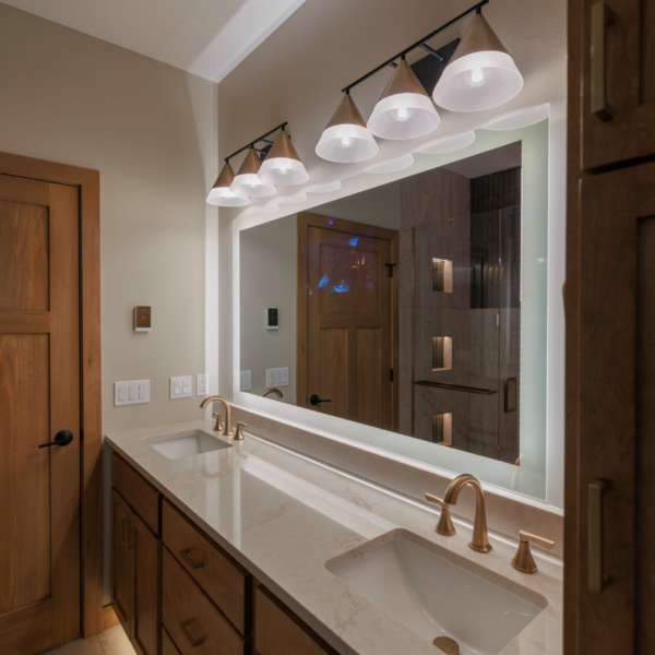 Master Bathroom double vanity featuring a mirror with border lighting and a hidden tv screen.