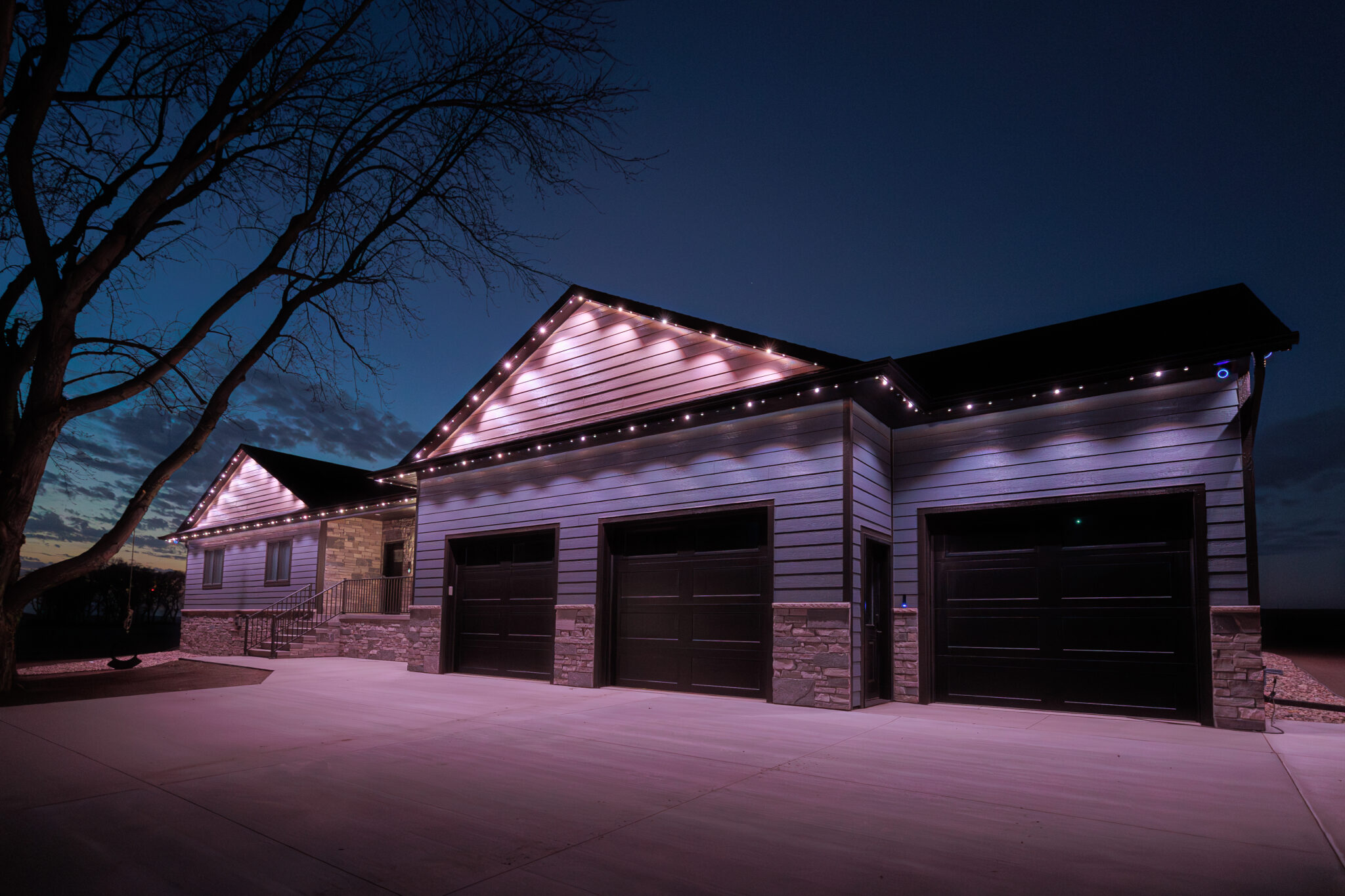 Ranch Style house lit up with white Gemstone Lights.